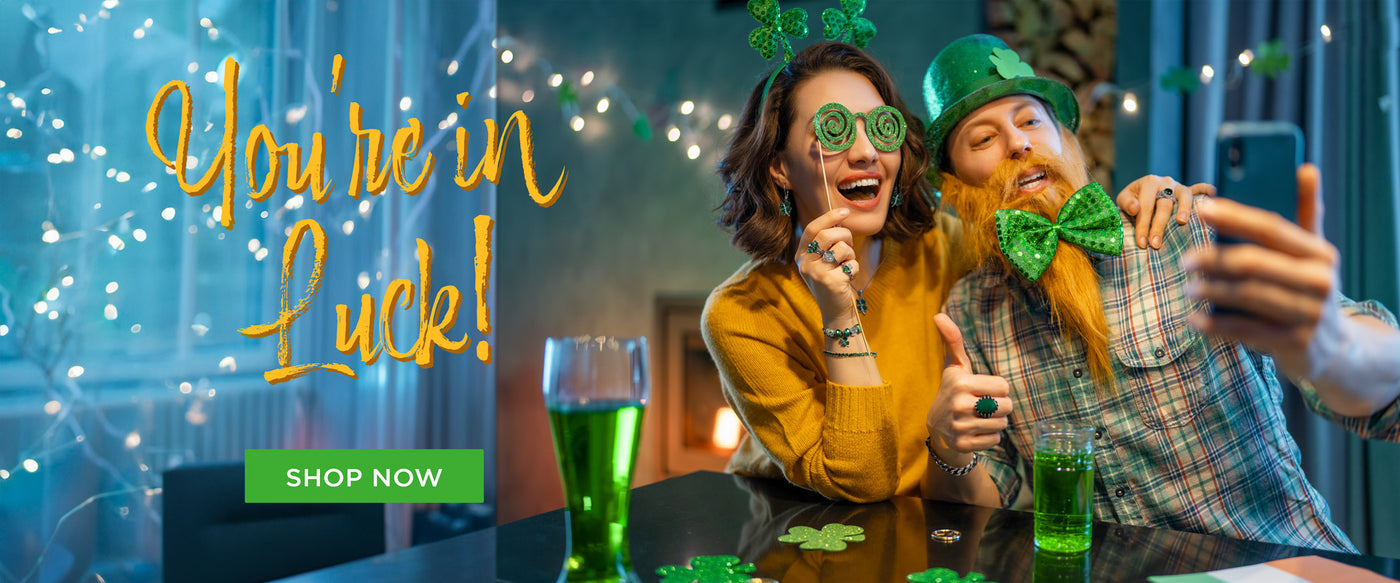 St Patrick Day Jewelry Collection with couple wearing festive outfits